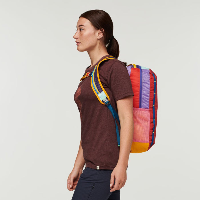 Female hiker preparing for an adventure with the Cotopaxi Batac backpack