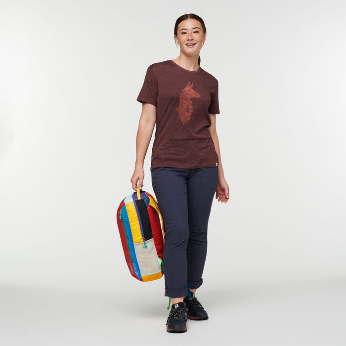 Casual style with a woman wearing a t-shirt and jeans, equipped with a Cotopaxi Batac backpack