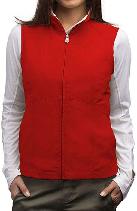 Woman modeling a red ScotteVest layered over a white shirt for a stylish look