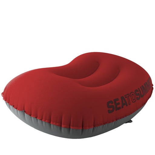 Aeros Ultralight Travel Pillow in red and grey partially inflated