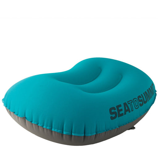 Blue and grey Aeros Ultralight Travel Pillow on a neutral background