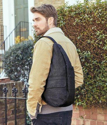 Individual wearing the AmeriBag Healthy Back Bag to show fit and design
