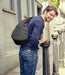Person modeling the AmeriBag Healthy Back Bag with a smile