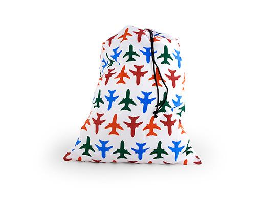 White laundry bag adorned with multicolored airplane designs