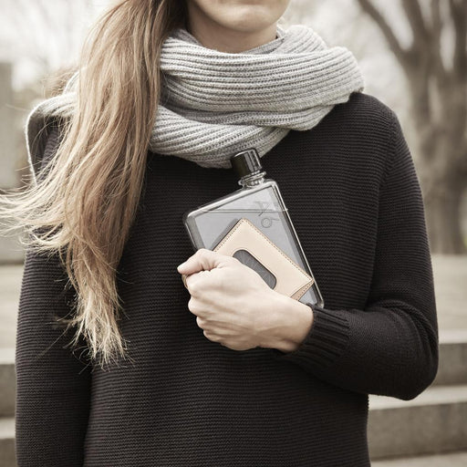 A6 memobottle held by a woman accessorized with a scarf