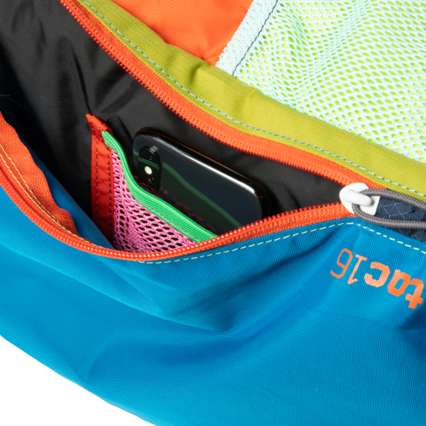 Cotopaxi Batac backpack in blue and orange with a smartphone pocket