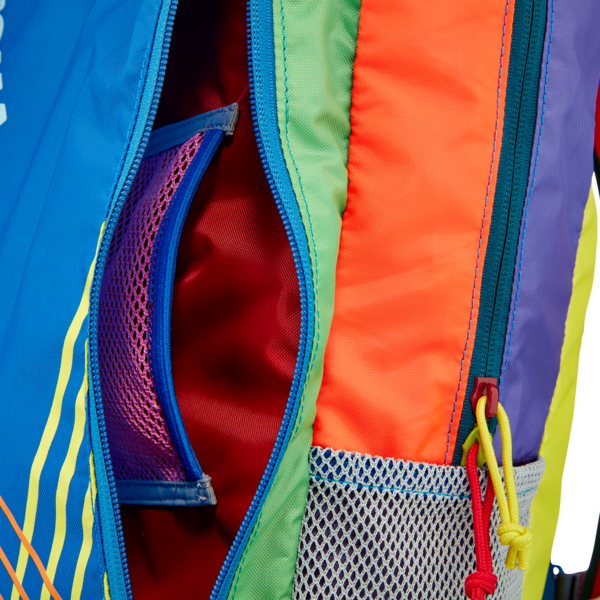 Cotopaxi Batac backpack with multiple zippers and colorful appearance