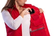 Woman using her cellphone while wearing her functional red ScotteVest