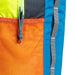 Detailed image of the zipper area on the Cotopaxi Batac backpack in blue and orange hues