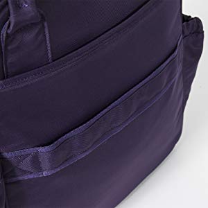 Detailed view of the Lug Mini Puddle Jumper's purple zipper pocket