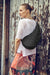 A woman wearing the AmeriBag Healthy Back Bag in black