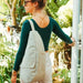 Woman pairing her outfit with a green AmeriBag Healthy Back Bag
