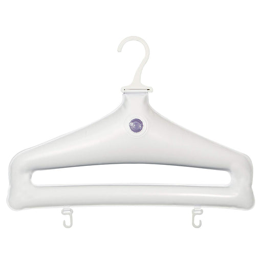 Close-up view of an inflatable hanger featuring a purple inflation valve, on a white surface