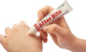 Hand holding a tube of After Bite Kids cream for soothing bug bites
