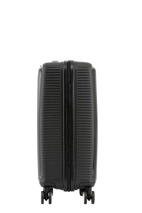 American Tourister Curio hardside carry-on spinner in black against a white backdrop
