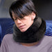 Female passenger wearing the Air Evolution neck pillow during a flight